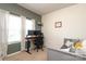 Bedroom setup for a home office features great natural light and neutral decor at 6719 Jerimoth Dr, Charlotte, NC 28215