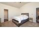 Cozy bedroom featuring a comfortable bed and neutral decor at 6719 Jerimoth Dr, Charlotte, NC 28215