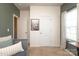 Bedroom boasts natural light from a window and neutral walls with two doors at 6719 Jerimoth Dr, Charlotte, NC 28215