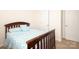 Bright bedroom with bed and fresh linens next to a window and a doorway at 6719 Jerimoth Dr, Charlotte, NC 28215