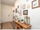 Stylish foyer featuring a wooden console table with decorative items and artwork, creating a welcoming ambiance at 6719 Jerimoth Dr, Charlotte, NC 28215