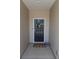 Inviting front entryway with a black door adorned with a floral wreath and a welcome mat at 6719 Jerimoth Dr, Charlotte, NC 28215
