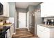 Kitchen showcasing stainless steel refrigerator, granite countertops, and white cabinetry at 6719 Jerimoth Dr, Charlotte, NC 28215