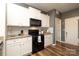 Beautiful kitchen with white cabinetry, modern appliances, granite countertops, and wood-look flooring at 6719 Jerimoth Dr, Charlotte, NC 28215
