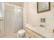 Bathroom featuring a shower, vanity with marble top, and a classic framed mirror at 7106 Marlbrook Dr, Charlotte, NC 28212