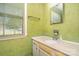 Bathroom with marble countertop and sink and decorative floral wallpaper at 7106 Marlbrook Dr, Charlotte, NC 28212