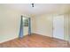 Bright bedroom with laminate floors, large window, and neutral wall colors at 7106 Marlbrook Dr, Charlotte, NC 28212