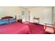 Comfortable bedroom with access to the outdoors, complemented by traditional furnishings at 7106 Marlbrook Dr, Charlotte, NC 28212