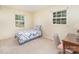 Bright bedroom featuring dual windows, and a comfortable bed with a patterned comforter at 7106 Marlbrook Dr, Charlotte, NC 28212