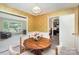 Cozy dining room featuring stylish wallpaper and a view of the living room and kitchen at 7106 Marlbrook Dr, Charlotte, NC 28212