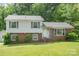 Charming two-story home with brick and vinyl siding and mature landscaping at 7106 Marlbrook Dr, Charlotte, NC 28212