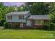 Charming two-story home with brick and vinyl siding and mature landscaping at 7106 Marlbrook Dr, Charlotte, NC 28212