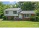 Charming two-story home with brick and vinyl siding and mature landscaping at 7106 Marlbrook Dr, Charlotte, NC 28212