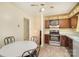 Efficient kitchen layout with stainless steel appliances and adjacent dining area at 7106 Marlbrook Dr, Charlotte, NC 28212