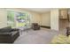 Bright living room with neutral carpet and large windows for ample natural light at 7106 Marlbrook Dr, Charlotte, NC 28212