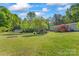 Expansive backyard lawn presents lots of space for outdoor recreation and enjoyment, near the home at 743 Dream Ln, Salisbury, NC 28146