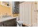 Bathroom featuring a toilet, shower with curtain, vanity, sink and storage at 743 Dream Ln, Salisbury, NC 28146