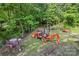 Forest equipment sitting in the backyard of the property, including a cement mixer and trailer at 743 Dream Ln, Salisbury, NC 28146
