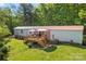 Home featuring a wooden deck perfect for outdoor relaxation and entertaining with a nice yard and landscaping at 743 Dream Ln, Salisbury, NC 28146