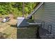 Side view of the storage structure, set amidst trees with covered components at 743 Dream Ln, Salisbury, NC 28146