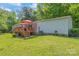 Charming home featuring a lovely wooden deck perfect for outdoor relaxation and entertaining under bright red umbrellas at 743 Dream Ln, Salisbury, NC 28146