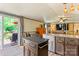 Modern kitchen flows into dining area, features an island, and sliding glass doors to a deck at 743 Dream Ln, Salisbury, NC 28146