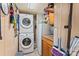 Laundry room featuring a stacked washer and dryer, cabinets, and storage at 743 Dream Ln, Salisbury, NC 28146
