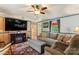Comfortable living room with a ceiling fan, modern furniture, and an electric fireplace at 743 Dream Ln, Salisbury, NC 28146
