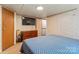 Spacious main bedroom features a large bed, dresser, mounted television, neutral walls and carpet at 743 Dream Ln, Salisbury, NC 28146
