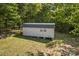Exterior view of a storage shed, built on a foundation with trees in the background at 743 Dream Ln, Salisbury, NC 28146