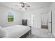 Bright bedroom with a dresser and a large window overlooking green landscape at 1005 Grand Oak Dr, Waxhaw, NC 28173