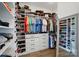 Walk-in closet with custom shelving, shoe racks, drawers, and storage solutions at 1005 Grand Oak Dr, Waxhaw, NC 28173