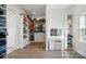 Spacious walk-in closet with custom shelving, drawers, vanity, and dressing area at 1005 Grand Oak Dr, Waxhaw, NC 28173