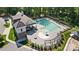 Aerial view of the community pool with pergola-covered seating, playground, and clubhouse for residents' enjoyment at 1005 Grand Oak Dr, Waxhaw, NC 28173