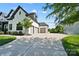 Spacious driveway leading to a three-car garage of a charming white brick home at 1005 Grand Oak Dr, Waxhaw, NC 28173