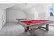 Well-lit game room featuring a red felt pool table and game equipment at 1005 Grand Oak Dr, Waxhaw, NC 28173