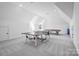 Spacious game room with ping pong table and pool table for entertainment at 1005 Grand Oak Dr, Waxhaw, NC 28173