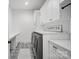 Well-organized laundry room with modern appliances, ample storage, and stylish flooring at 1005 Grand Oak Dr, Waxhaw, NC 28173