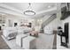 Open floor plan featuring living room with fireplace and view into kitchen and staircase at 1005 Grand Oak Dr, Waxhaw, NC 28173
