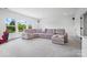 Bright living room featuring a large sectional sofa and great outdoor views at 1005 Grand Oak Dr, Waxhaw, NC 28173
