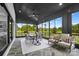 Enclosed sunroom with stone floors and panoramic views of the outdoor landscape at 1005 Grand Oak Dr, Waxhaw, NC 28173