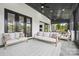 Cozy sunroom with comfortable seating and modern design elements, perfect for relaxing or entertaining guests at 1005 Grand Oak Dr, Waxhaw, NC 28173