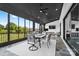 Spacious sunroom with comfortable seating and views of lush outdoor greenery at 1005 Grand Oak Dr, Waxhaw, NC 28173