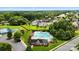 Aerial view of community with a sparkling swimming pool, lush landscaping, clubhouse, and tennis courts at 1011 Potomac Rd, Indian Trail, NC 28079