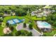 Aerial view of community amenities including tennis courts, playground, swimming pool, and well manicured common areas at 1011 Potomac Rd, Indian Trail, NC 28079