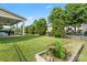 Backyard showcasing a well-manicured lawn and covered patio, perfect for relaxation at 1011 Potomac Rd, Indian Trail, NC 28079