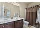 Bathroom featuring double sinks, shower with curtain, and modern fixtures at 1011 Potomac Rd, Indian Trail, NC 28079