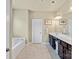 Clean bathroom featuring double vanity, tile floors, and separate bath and shower areas at 1011 Potomac Rd, Indian Trail, NC 28079