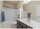 Bathroom featuring a single sink vanity, shower with white curtain, and neutral paint at 1011 Potomac Rd, Indian Trail, NC 28079