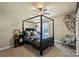 Bedroom with four poster bed, ceiling fan, and window with natural light at 1011 Potomac Rd, Indian Trail, NC 28079